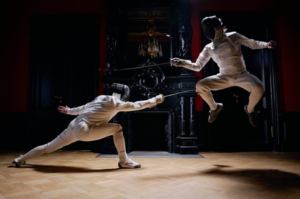 a fencer jumping in a duel